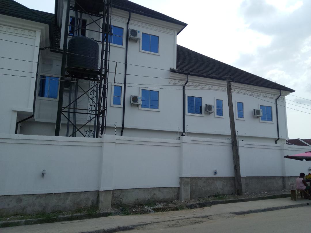 Completed exterior coating work photographed on site in Calabar